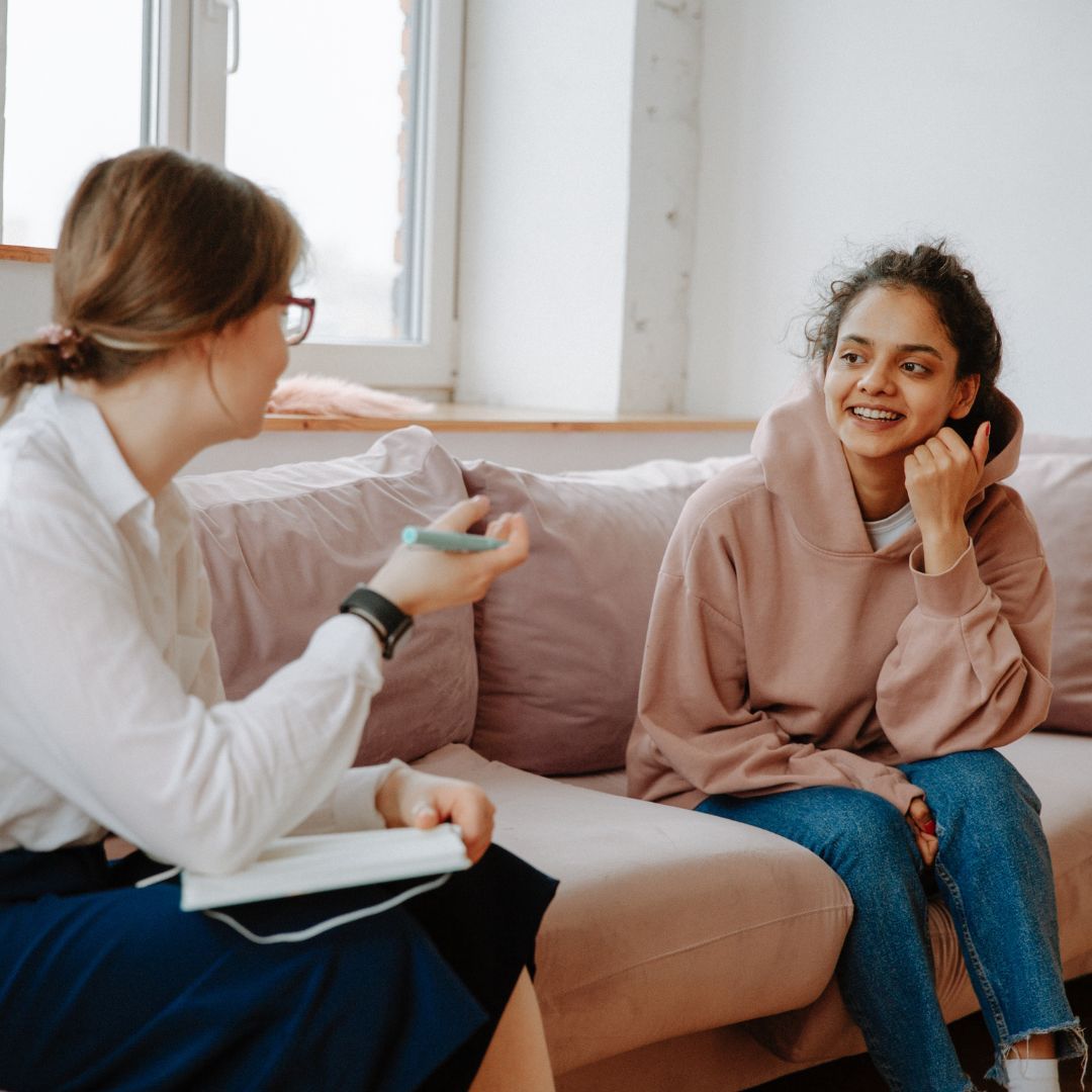 Two woman speaking 