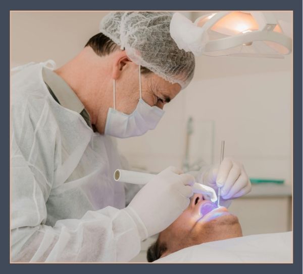 dentist working on patient's teeth