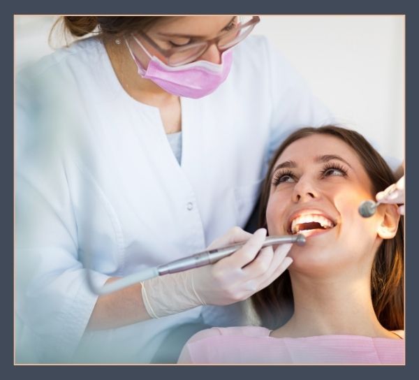 happy woman with dentist 