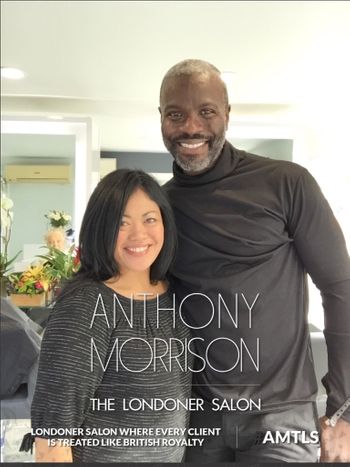 Anthony Morrison smiling with a happy client at THE LONDONER hair salon in Hermosa Beach.