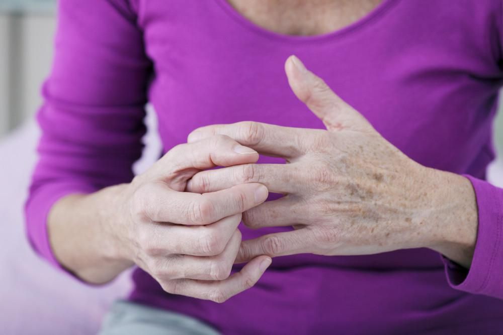 woman holds her hand 