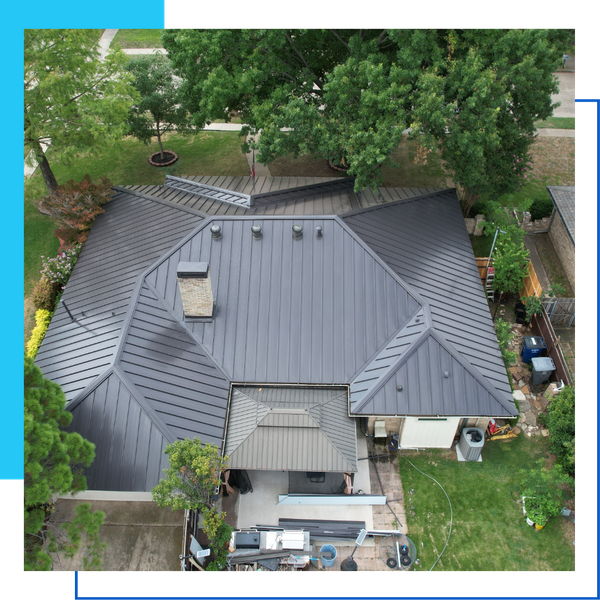 High-altitude aerial view of a modern charcoal standing seam metal roof on a high-end residential property.