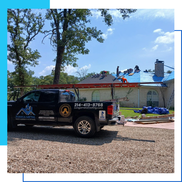 Zuniga Metal Roofing branded service truck on a residential job site with crew members working on a roof in the background.