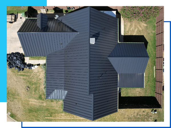aerial view of house with metal roof