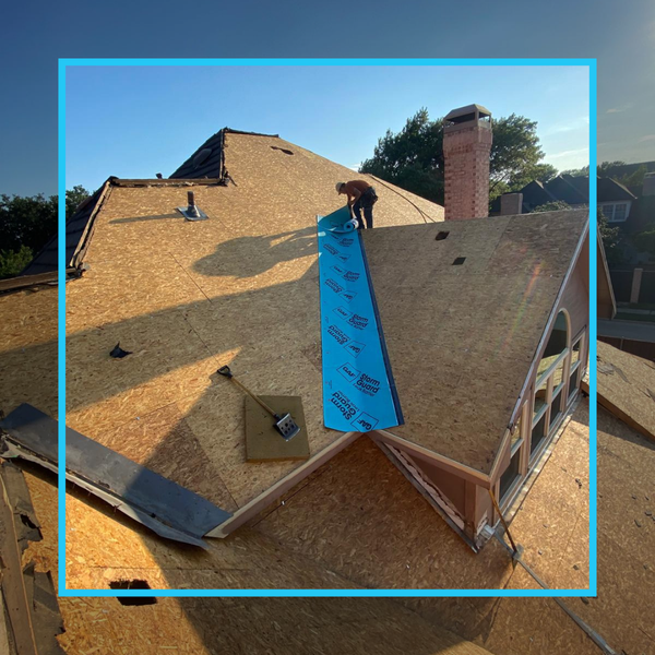 Close-up of blue GAF StormGuard leak barrier being installed in a roof valley for superior waterproofing and protection.