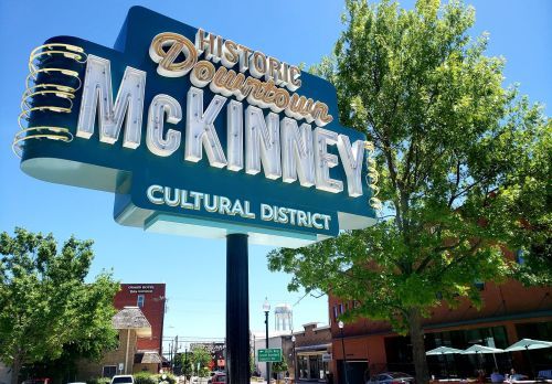 Downtown-McKinney-sign-Hero-Image-with-blue-sky_water-tower_park