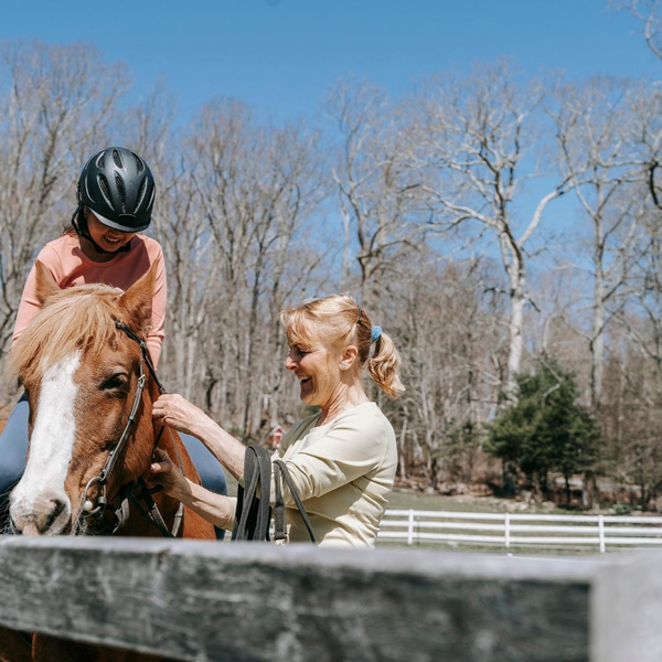 horseback riding instructor and student