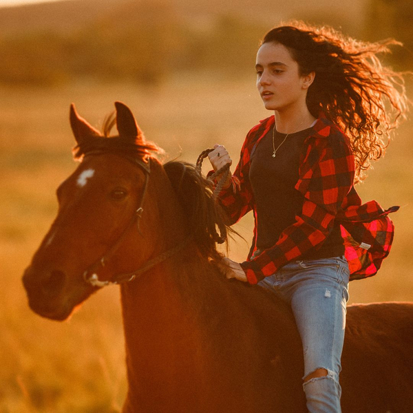 Girl riding horse