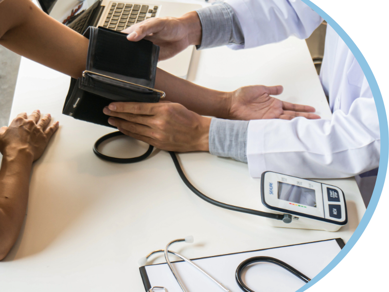 doctor taking a patient's blood pressure