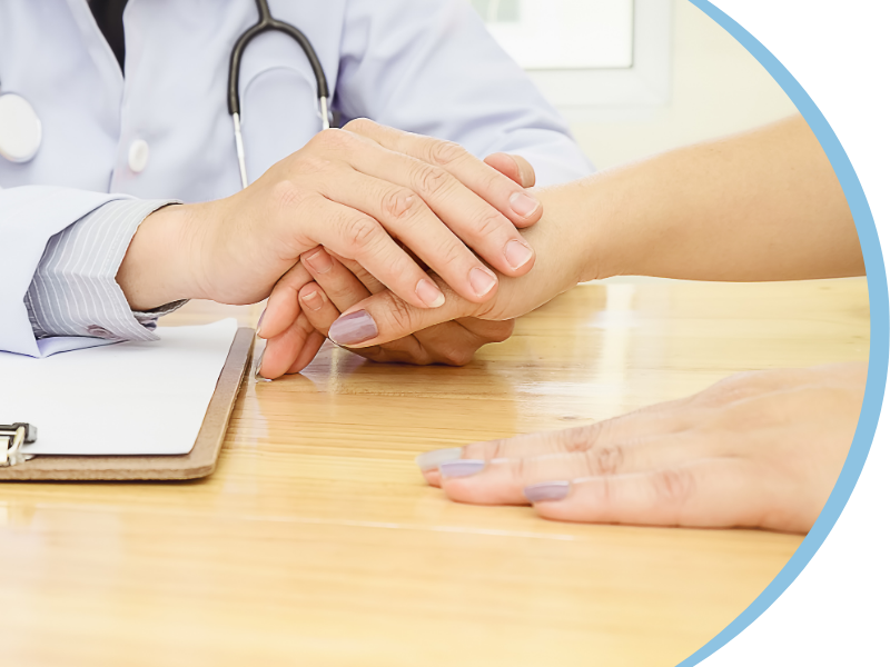 doctor holding a patient's hand