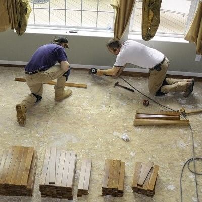 Image of crew restoring damaged flooring