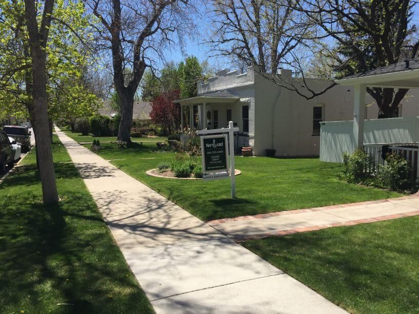 a well maintained lawn with hardscaped gardens