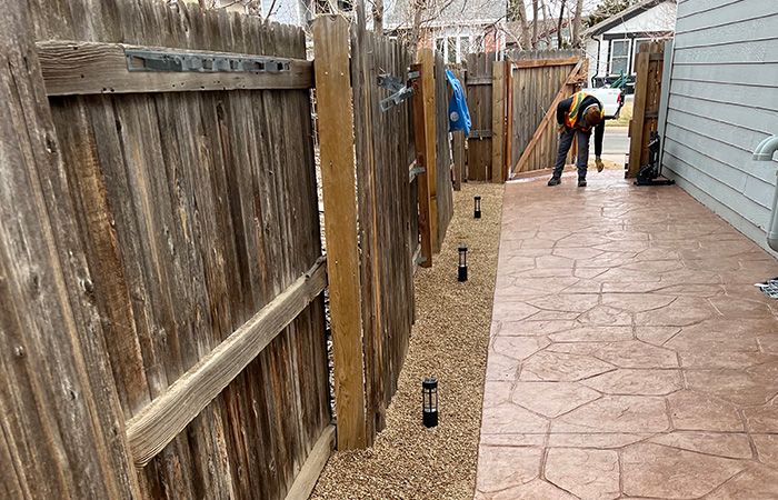 a hardscaped walkway with lights