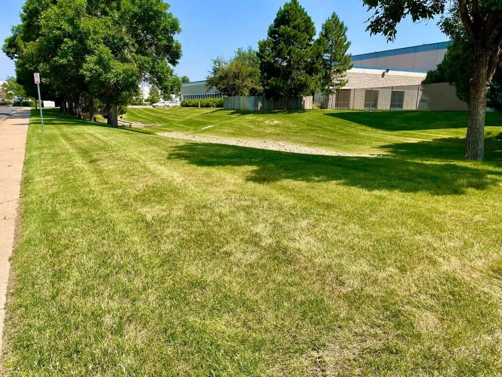 a large well cut commercial lawn on a hill