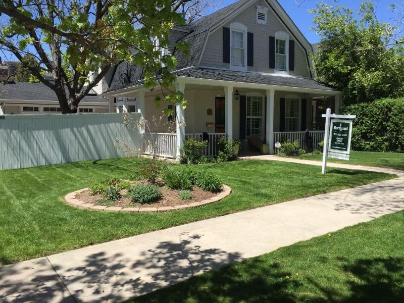 a well maintained lawn with hardscaped gardens