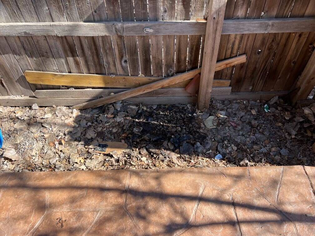 a before image of a strip of rubble next to a walkway