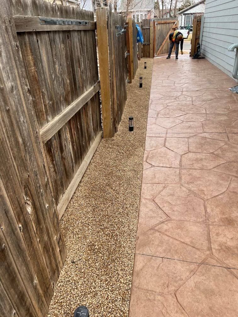 an after image of a hardscaped walkway with lights