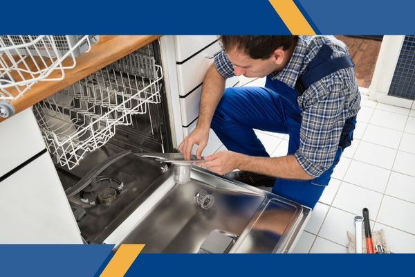 appliance repair technician working on a dishwasher appliance repair technician working on a dishwasher