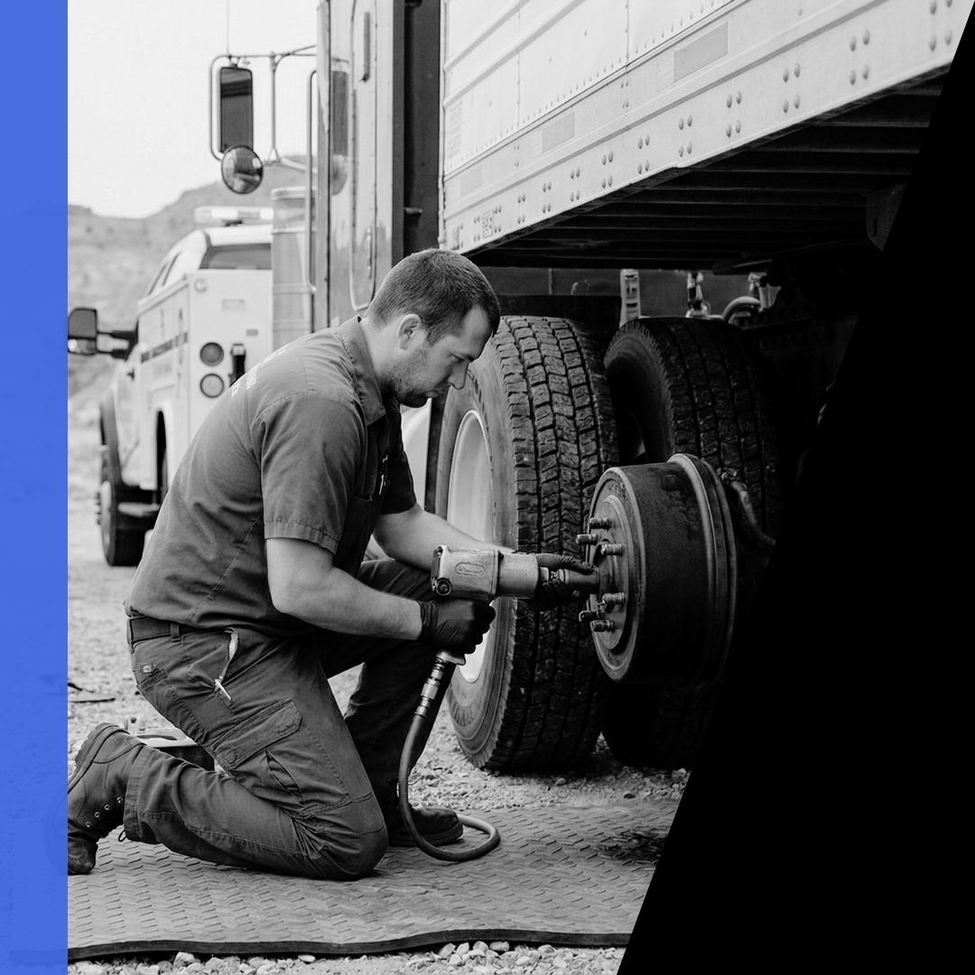 A Mobile Mechanic Men technician performs a roadside semi-truck brake repair on a trailer on SR-122 near Helper, Utah.