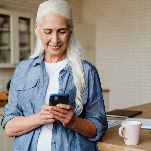 Woman smiling at her phone