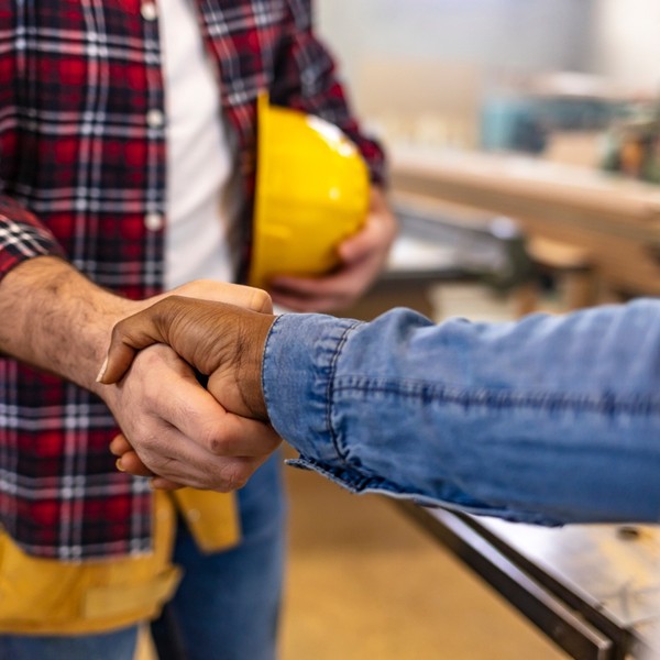 contractor and client shaking hands