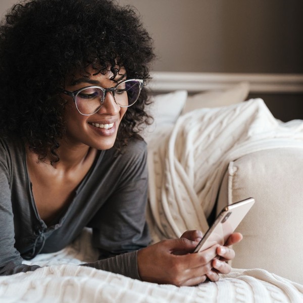 Woman smiling at her phone