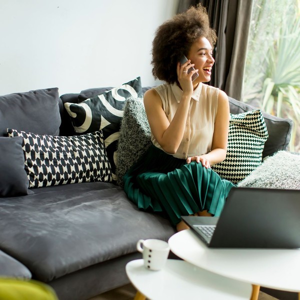 woman in her living room talking on phone