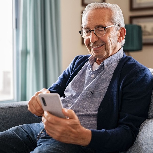 Man smiling at his phone