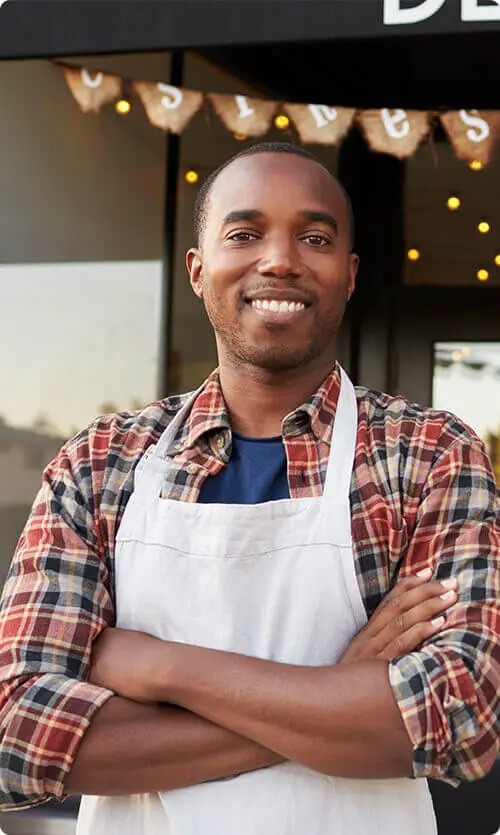 black-male-business-owner-standing-outside-coffee.jpg