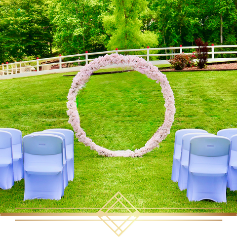 large ring of flowers in front of seating area