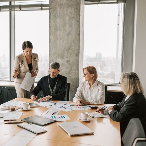 business people looking over numbers at meeting