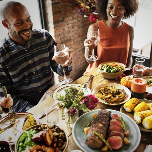 Group cheers at a dinner
