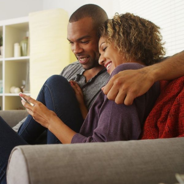a young couple enjoying music during an online church service a young couple enjoying music during an online church service