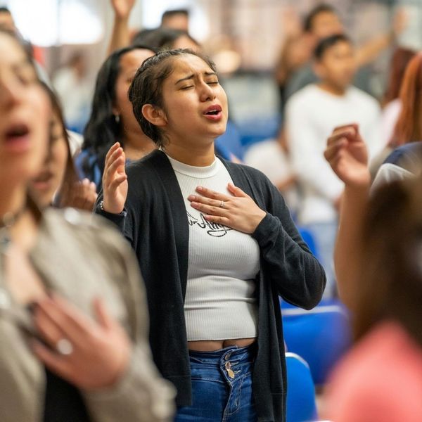 person worshipping and singing 