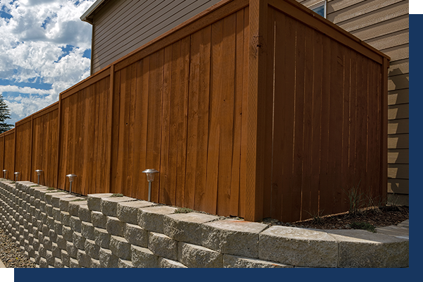 retention wall along a driveway and privacy fence