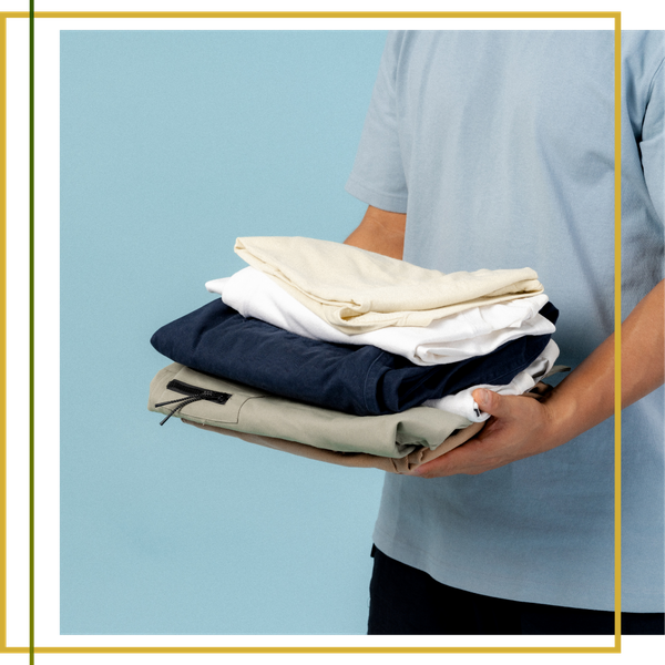 holding stack of folded laundry holding stack of folded laundry