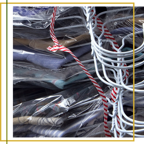 stack of dry cleaned clothes