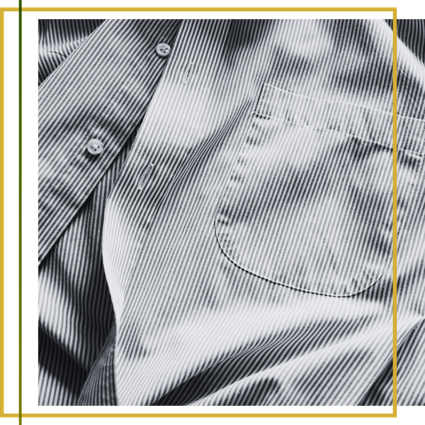 striped collared shirt laid out striped collared shirt laid out