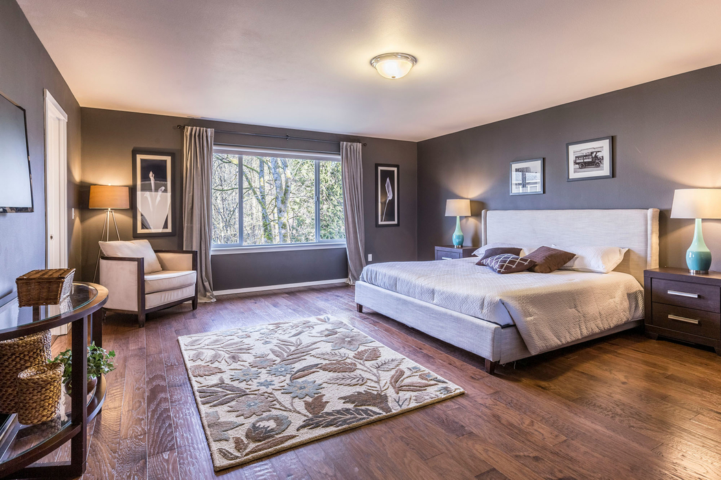 A wide shot of a professionally staged bedroom with perfect lighting, ready for a photo shoot A wide shot of a professionally staged bedroom with perfect lighting, ready for a photo shoot