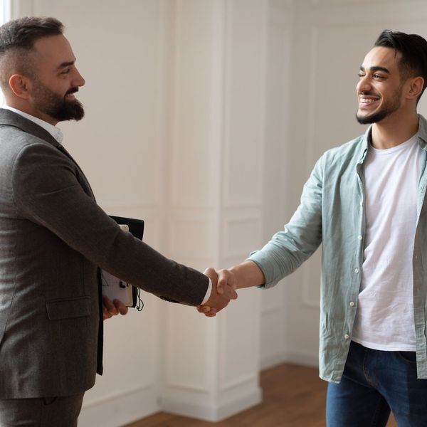 man shaking hands with realtor