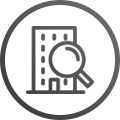 building magnifying glass icon