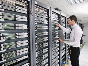 Image of a man working on servers