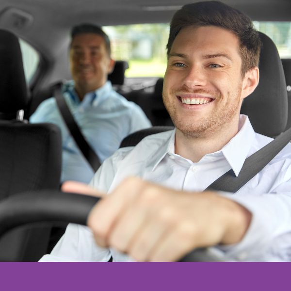 a man happily driving a person around