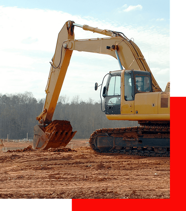 Backhoe clearing land