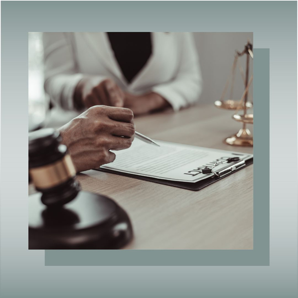 Gavel and legal paperwork being reviewed by an attorney