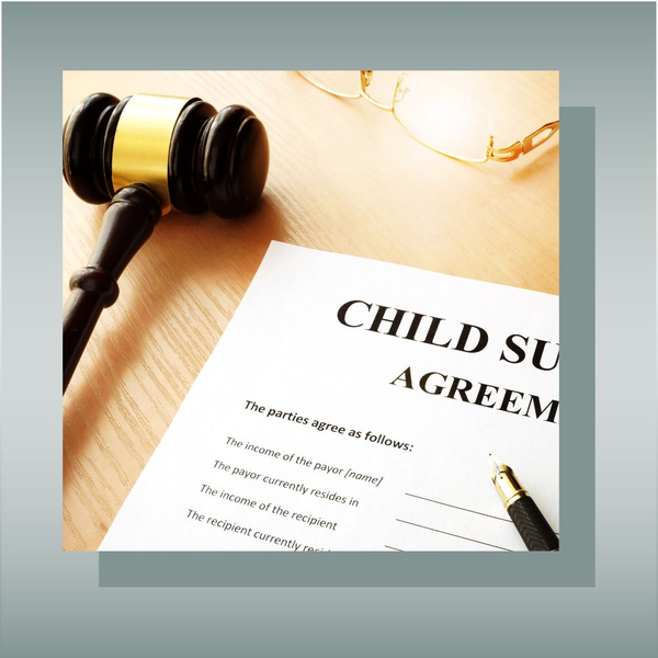 Child support agreement and gavel on a legal desk