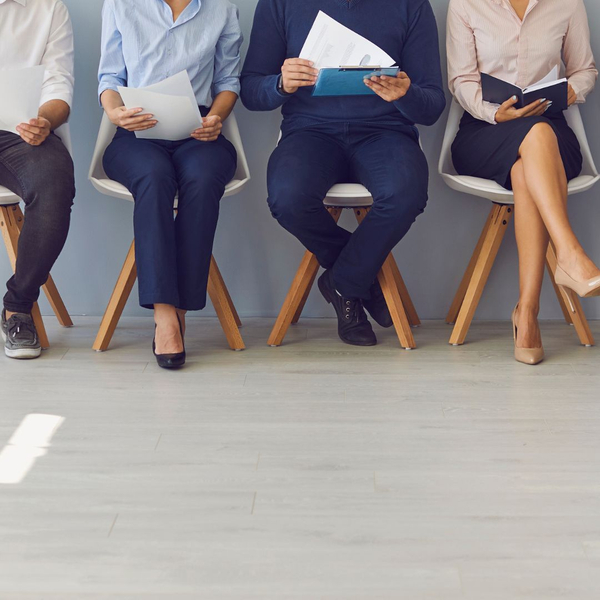 A line of employees being interviewed A line of employees being interviewed