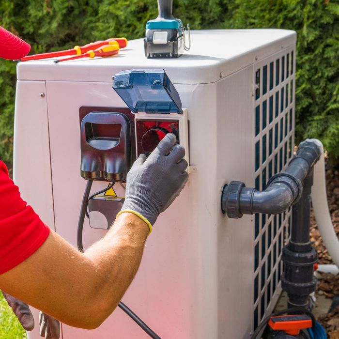 a person working on a power supply