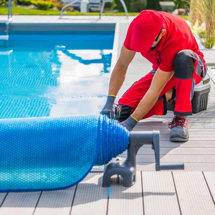 a maintenance person working on a pool