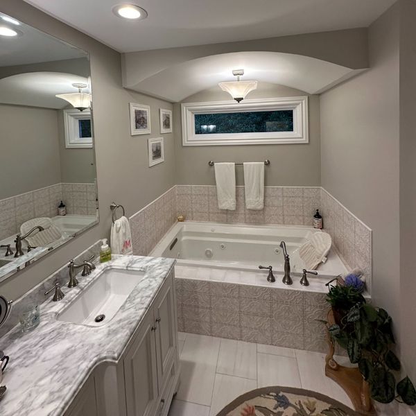 Bathroom with mosaic bath tiling